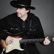 Roger Street Friedman playing electric guitar